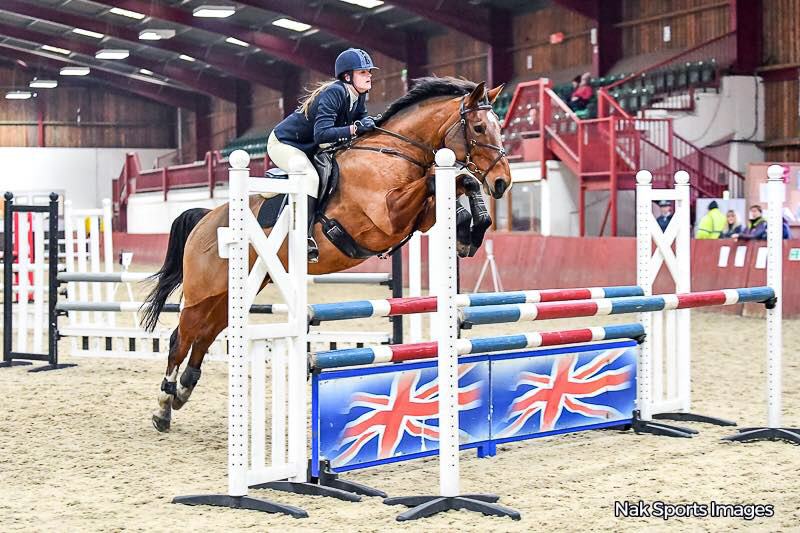 Rider clearing a Union Jack show jump